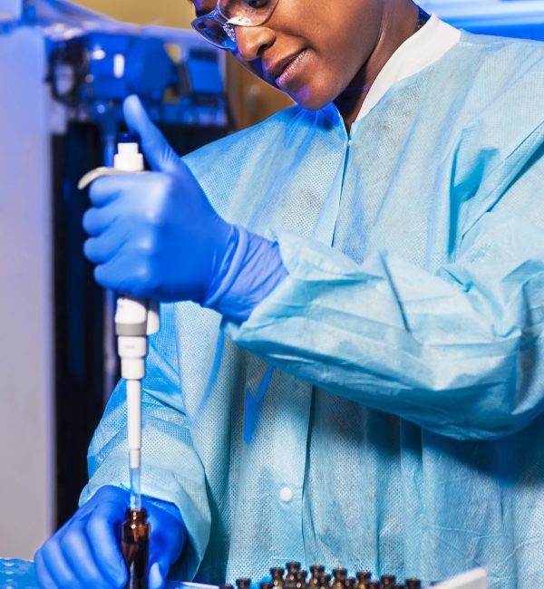 woman holding brown glass